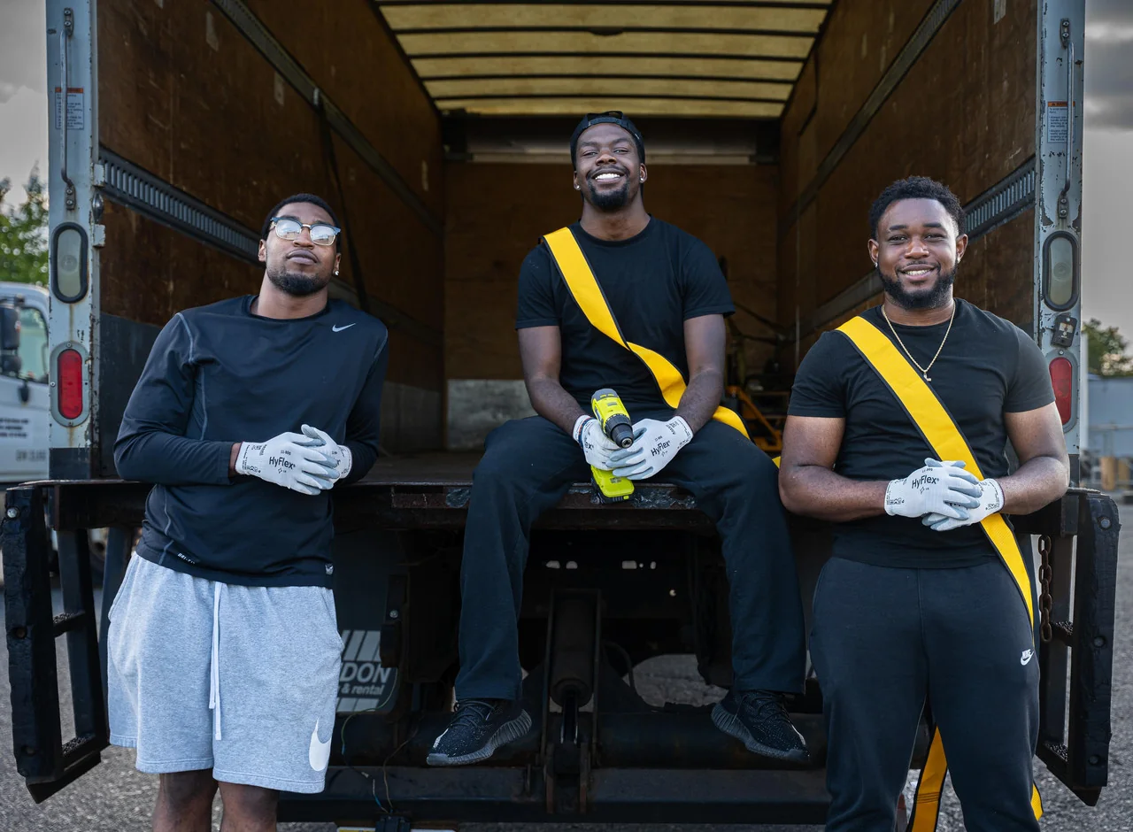 Haul Yeah Moving three-man crew at the open box of a 26-ft moving truck in Essex County NJ